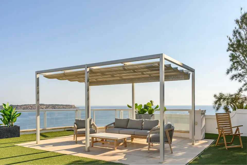 Outdoor seating overlooking Mellieha Bay at Ambio Malta.