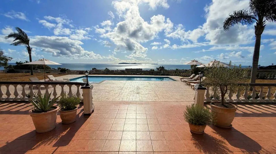 Ocean-facing swimming pool and terracotta terrace at Casa Santa Isabel