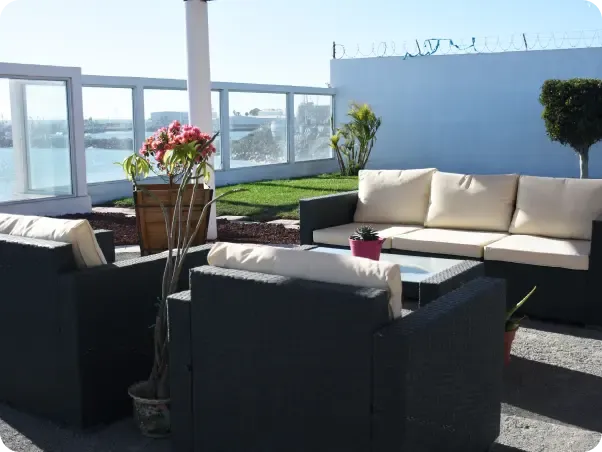 Outdoor wicker seating at the New Roots Ibogaine facility