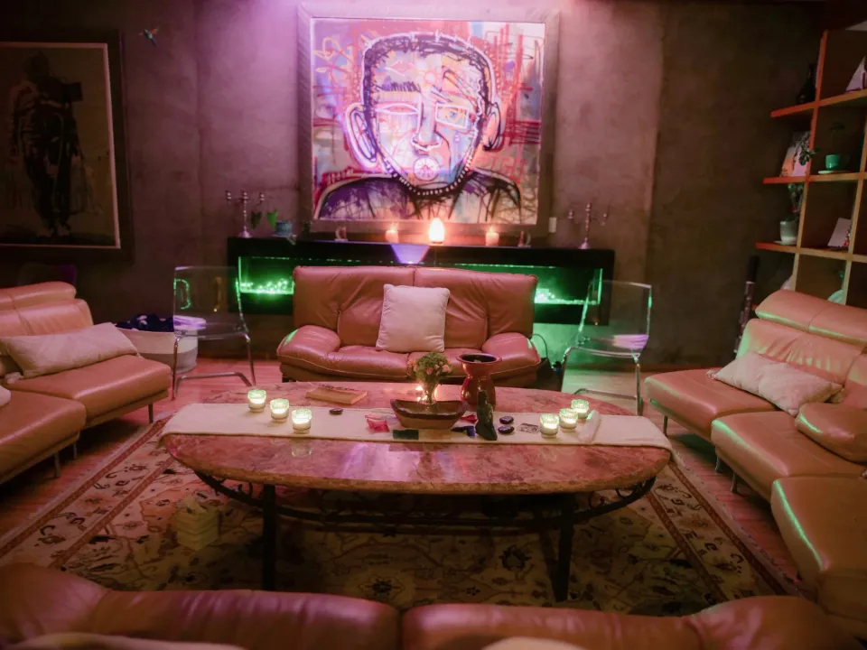 Lounge with armchairs and artwork at The Mission Within